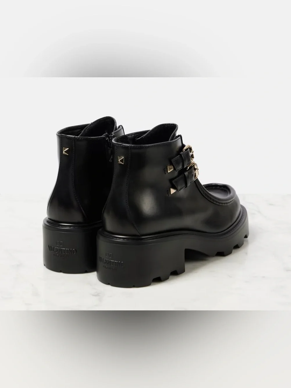 Valentino Garavani Black Leather Lug-Sole Ankle Boots with Studded Double Straps